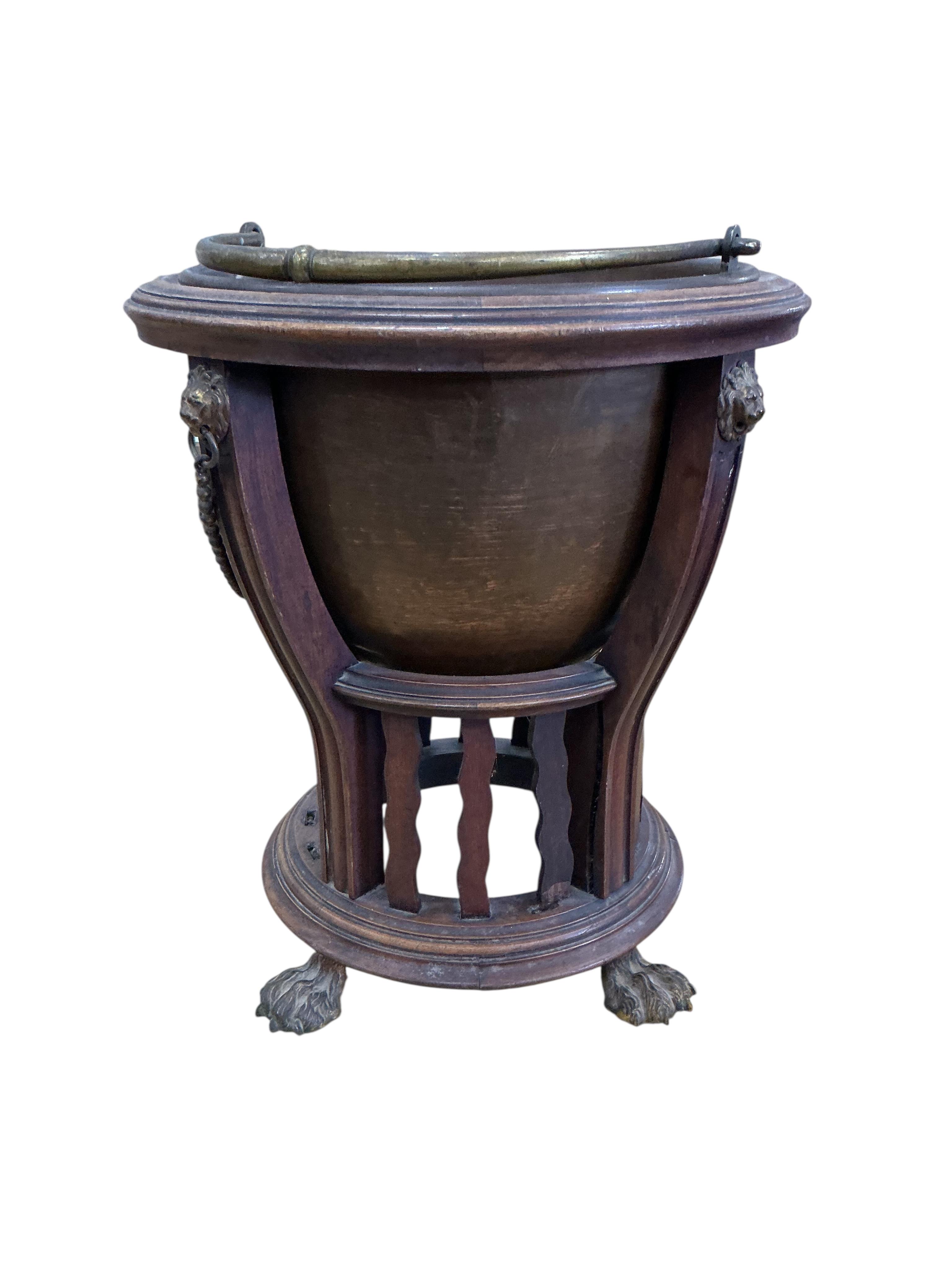 An Edwardian brass mounted circular mahogany coal bucket, with liner, diameter 37cm, height 42cm